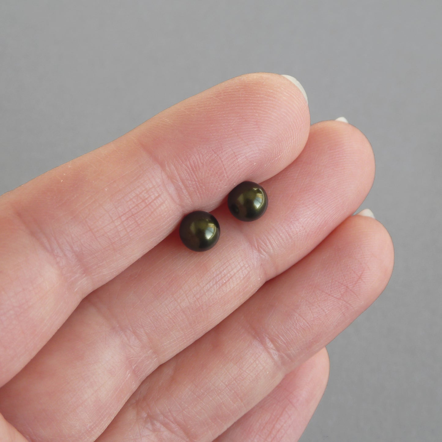Small dark green stud earrings