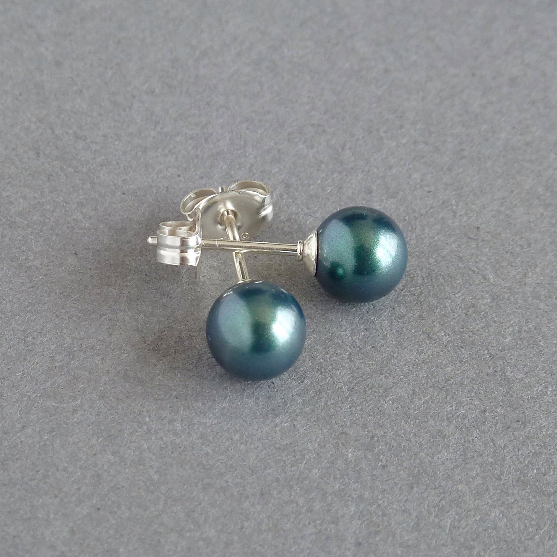 Small emerald green stud earrings