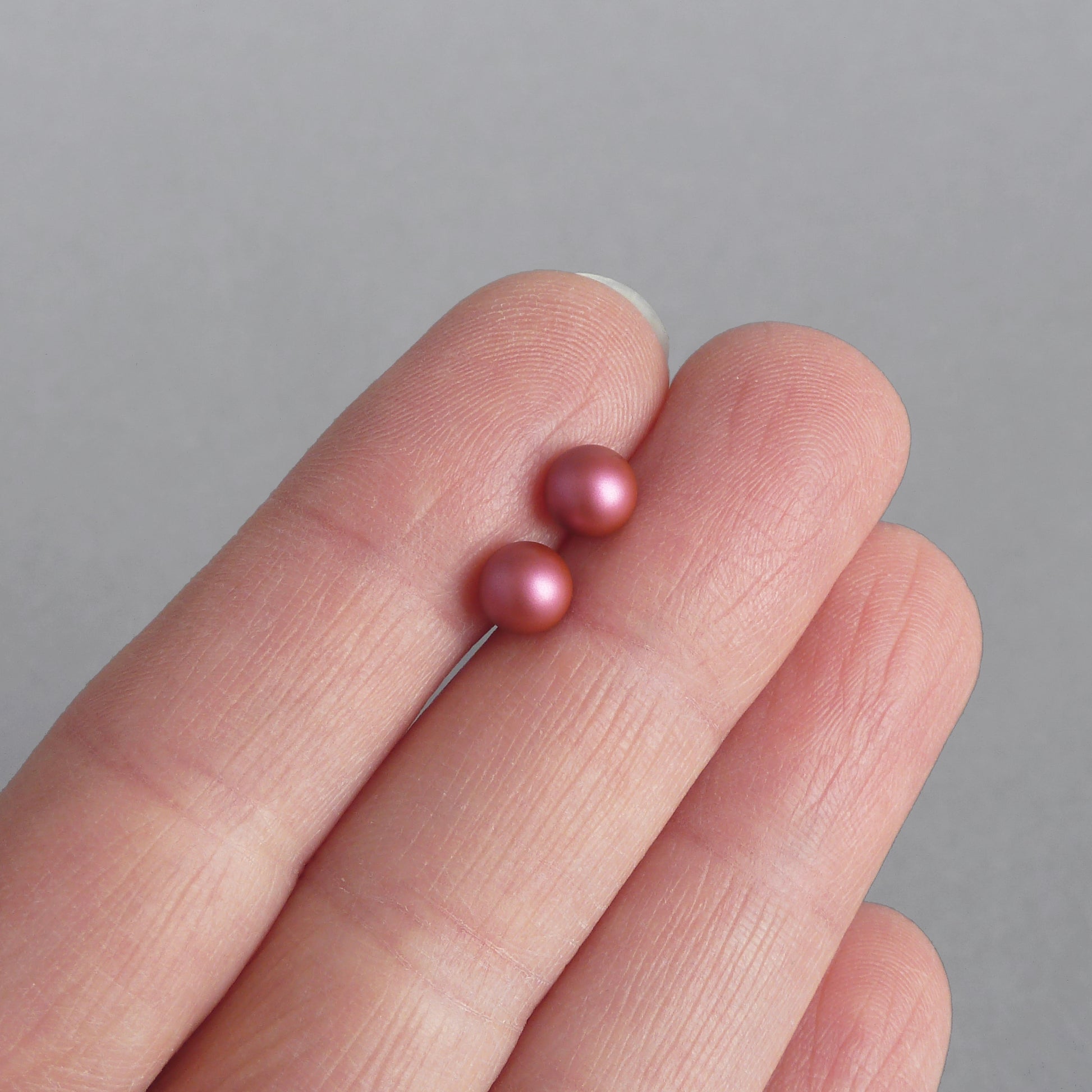 Small fuchsia pearl stud earrings