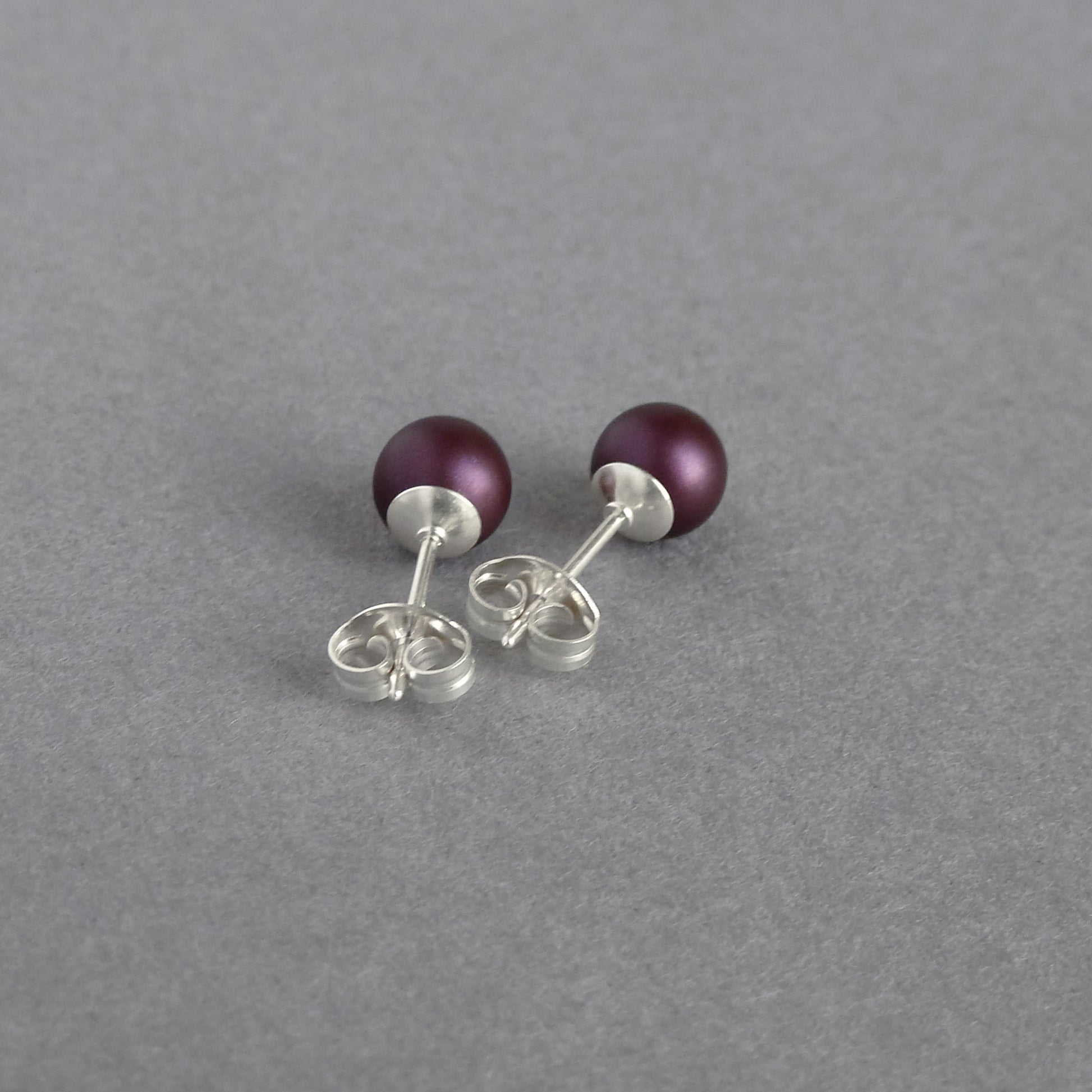 Small plum stud earrings