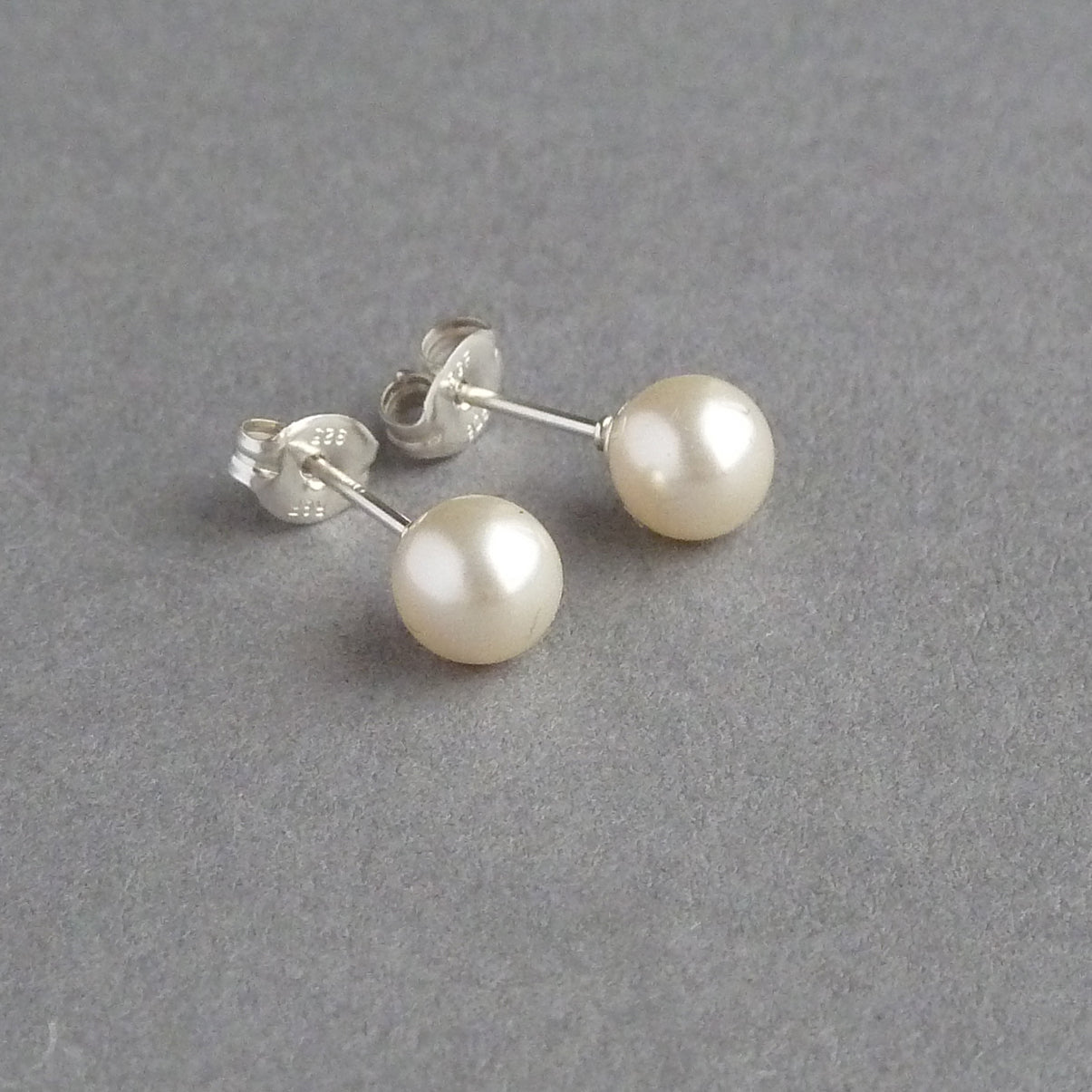Round cream pearl stud earrings